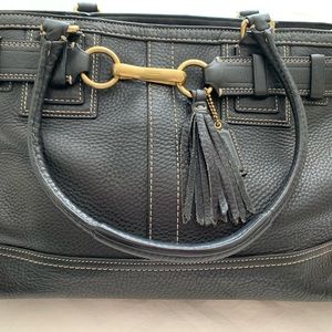 Coach genuine leather bag with wrist handles. Lightly used but like new!